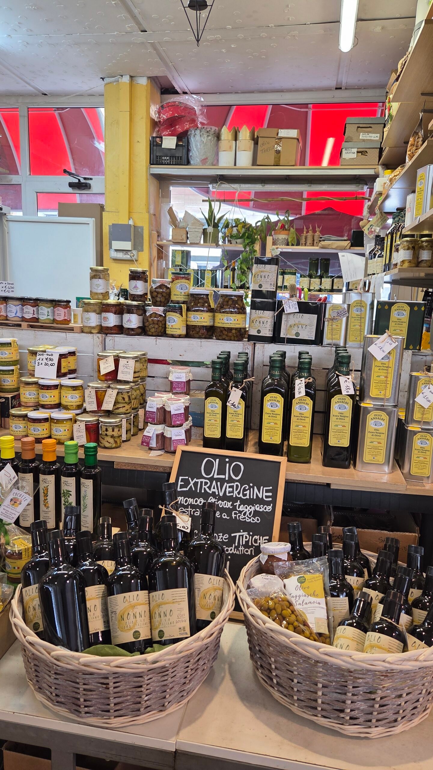 Extra virgin olive oil bottles for sale at Mercato Coperto market, Ventimiglia
