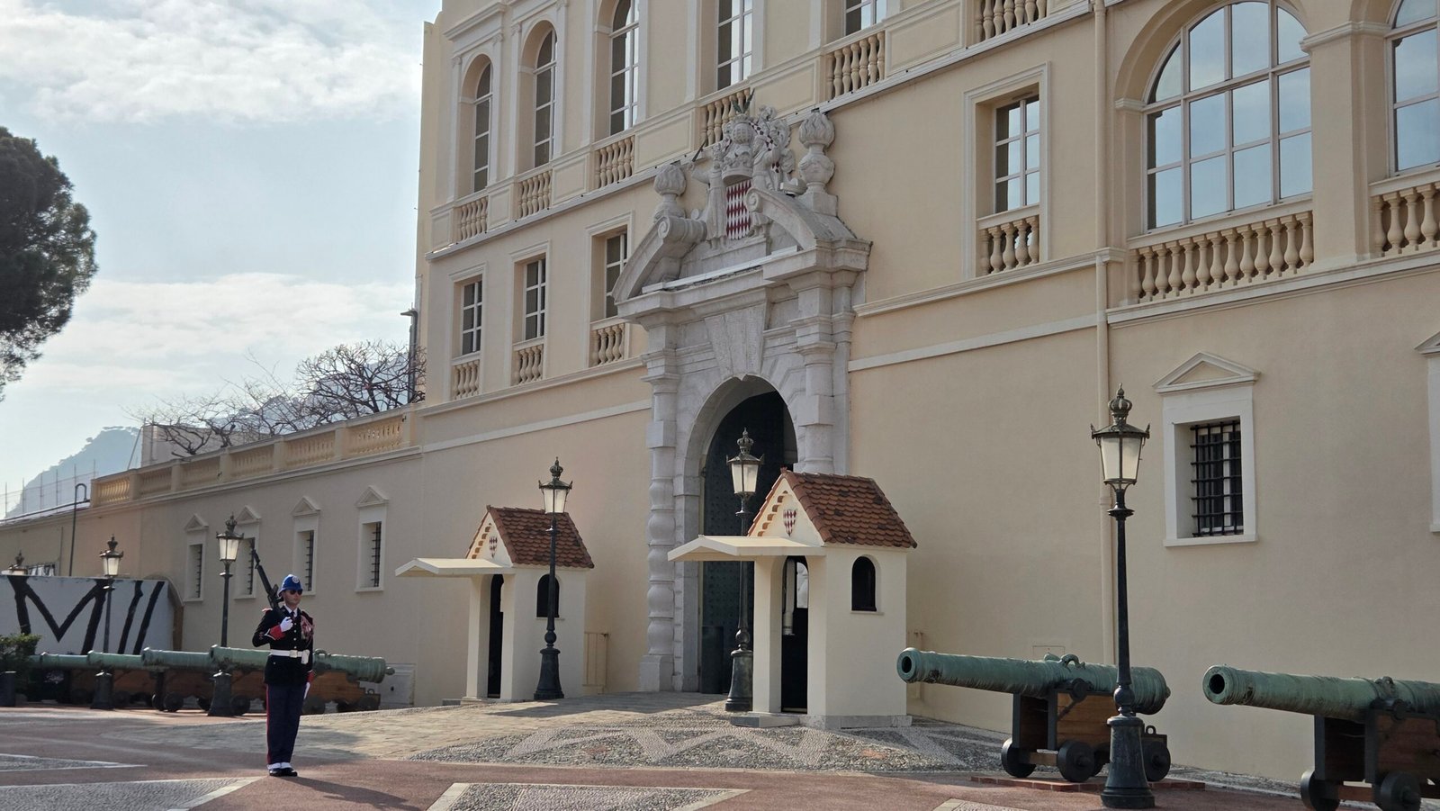 Guard and antique cannons in front of the Prince's Palace of Monaco
