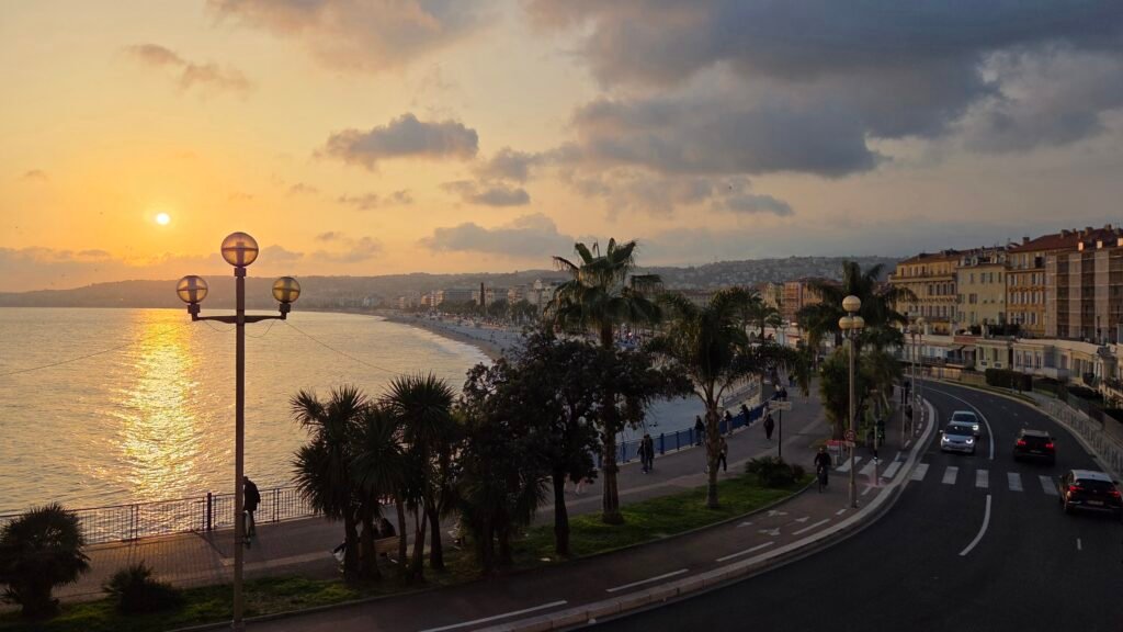Sunset over the Baie des Anges and the Promenade des Anglais, seen from the balcony at Hotel Suisse Nice