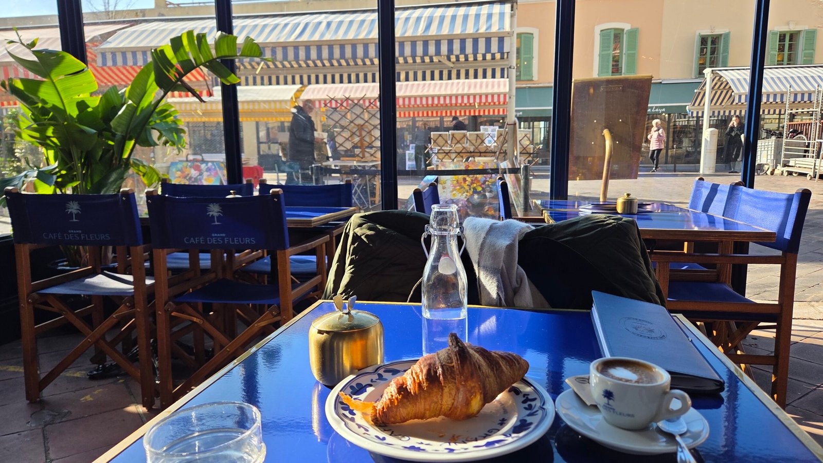 Croissant and coffee at Grand Cafe des Fleurs in Nice's Old Town, near Hotel Suisse