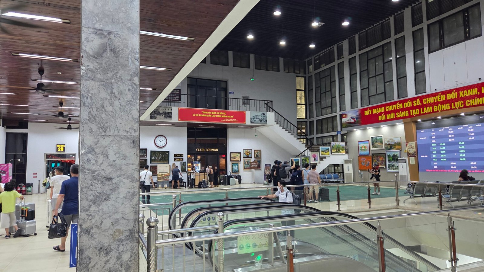Departure board and waiting hall inside Hanoi Station before boarding the sleeper train to Sapa