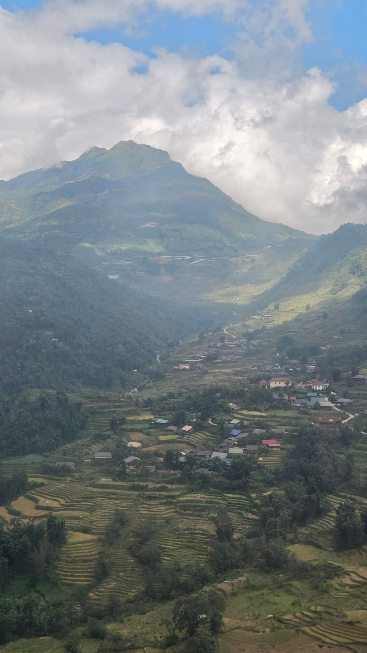 Sapa valley and terraced villages seen from inside the Fansipan cable car