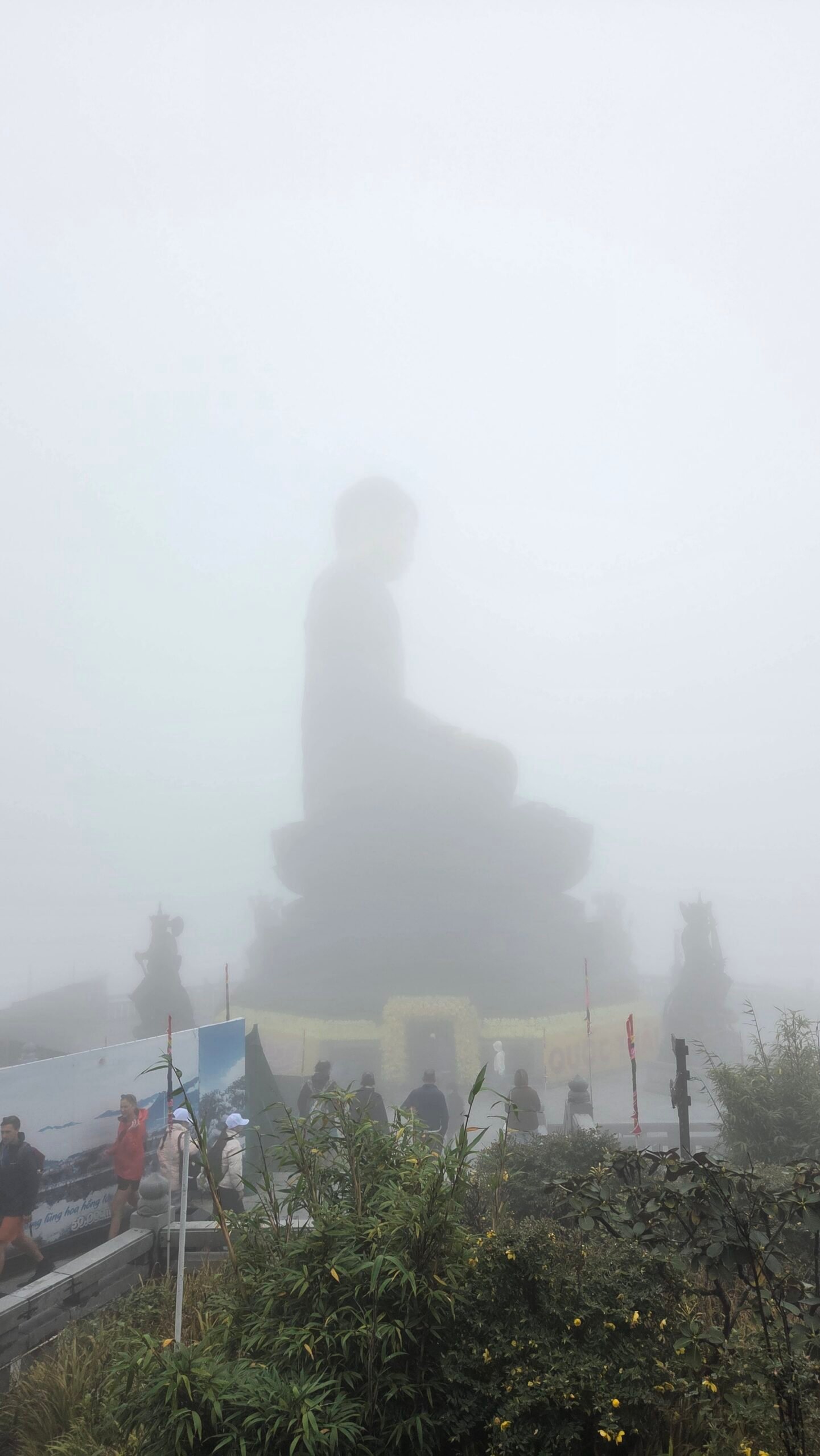 Giant Buddha statue on Fansipan almost hidden in summit fog