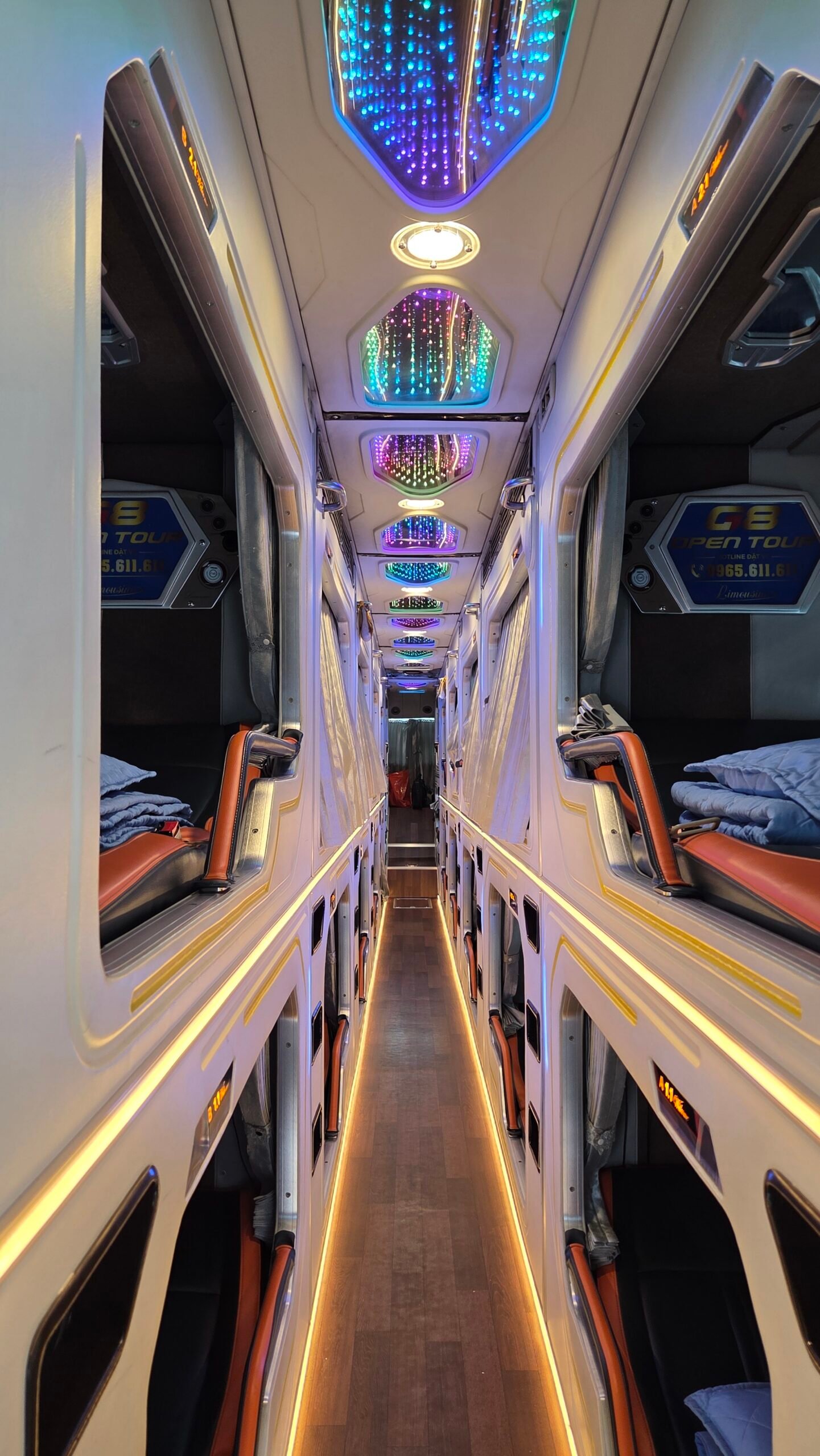Full view inside the G8 Open sleeper bus, bunks on both levels