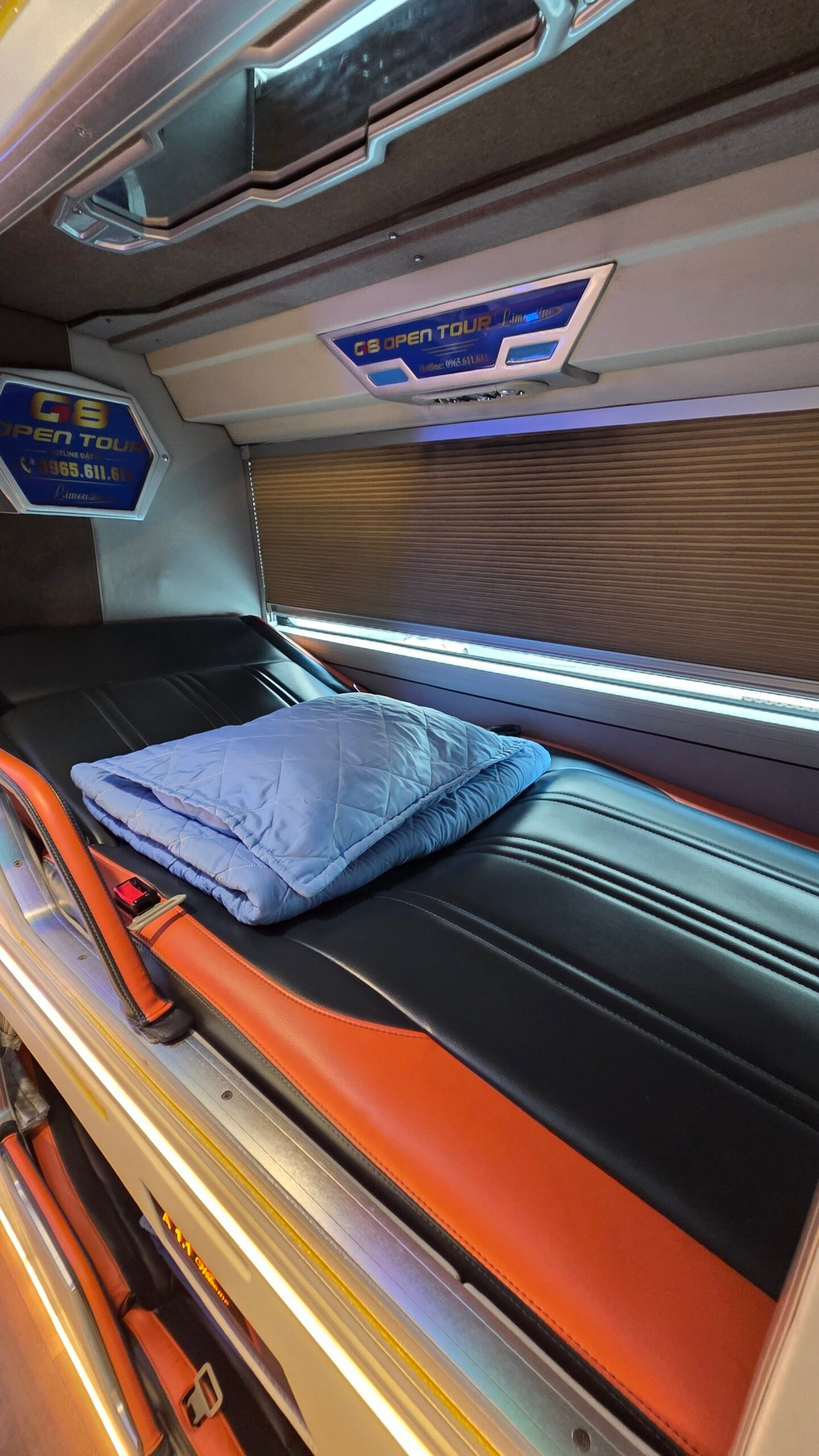 Reclining seats and blankets inside the G8 Open sleeper bus from Sapa to Hanoi